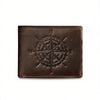 A dark brown leather wallet featuring an engraved compass design on the surface.