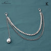 Silver multi-layer metal chain strap charm with a pearl dangle on a dark blue background