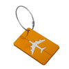 A bright orange aluminum luggage tag with a white airplane silhouette attached to a silver cord.