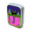 A rectangular metal storage box with a purple and pink print featuring fish and geometric shapes.