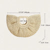 A beige rattan half-moon beach handbag with a textured weave and a rectangular opening.