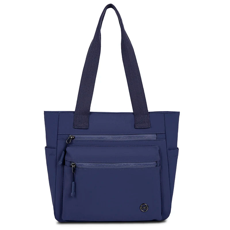 Navy blue canvas tote bag with two zippered pockets and dark straps