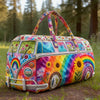 A vintage sunflower quilted duffle bag featuring a rainbow gradient pattern and floral designs, resting on grass.