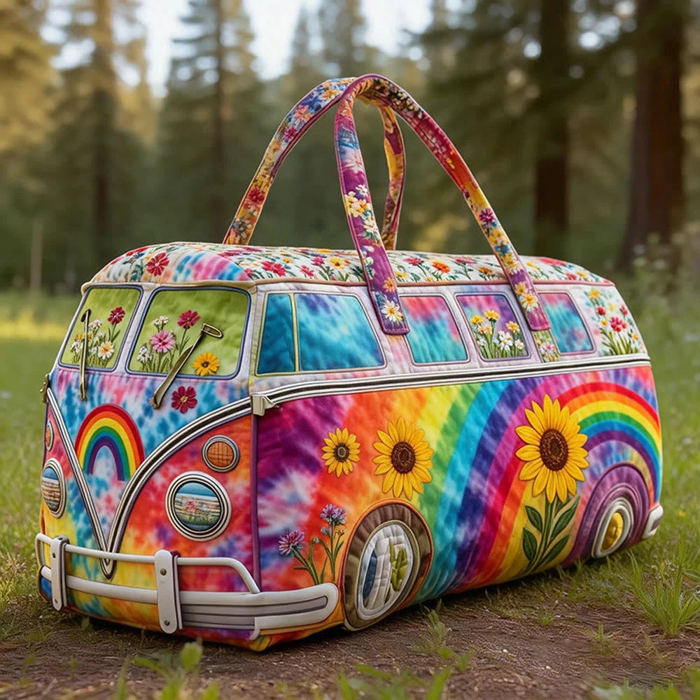 A vintage sunflower quilted duffle bag featuring a rainbow gradient pattern and floral designs, resting on grass.