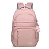 Mochila ligera rosa para universidad y deportes con compartimento para laptop y dije de unicornio.