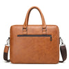 A brown men's PU leather business briefcase bag with a top handle and zipper pocket.
