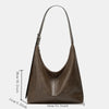 A brown soft PU leather retro tote bag with a zipper closure shown against a white background.