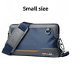 A small gray and blue crossbody bag with a dark blue adjustable strap and silver hardware.