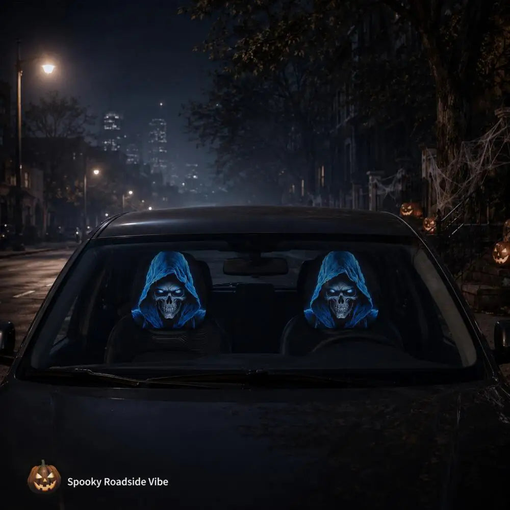 Two gothic skull headrest covers with a blue glow design are visible inside a dark car at night.