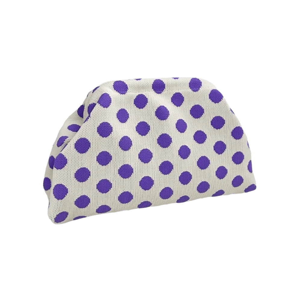 A clutch bag featuring a light purple and white polka dot pattern.