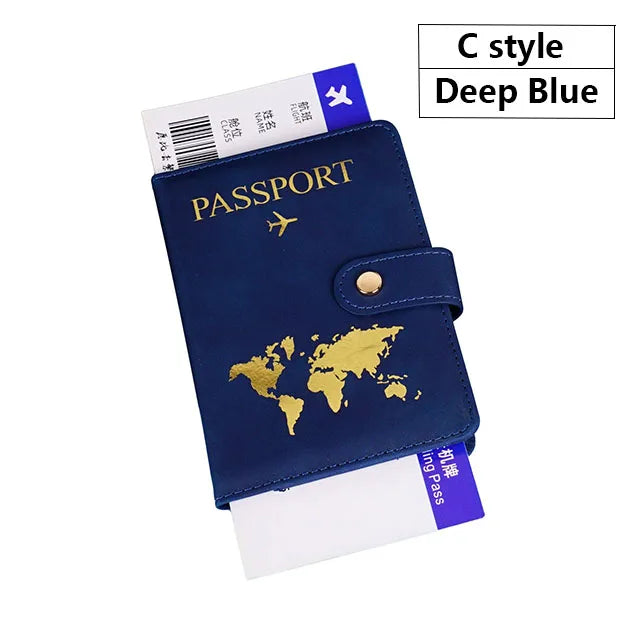 A navy blue C style passport holder cover with gold accents and a passport inside.