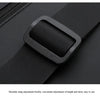 Close-up of a black anti-theft crossbody strap adjustment buckle on a bag.