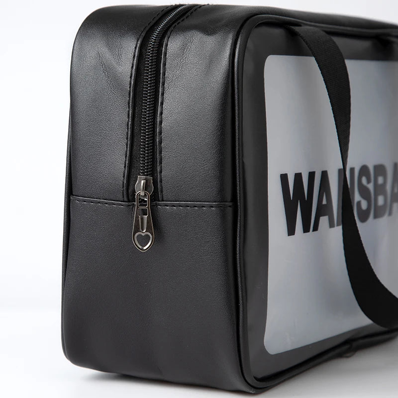 Black leather waterproof travel toiletry bag with a silver zipper and a white label.