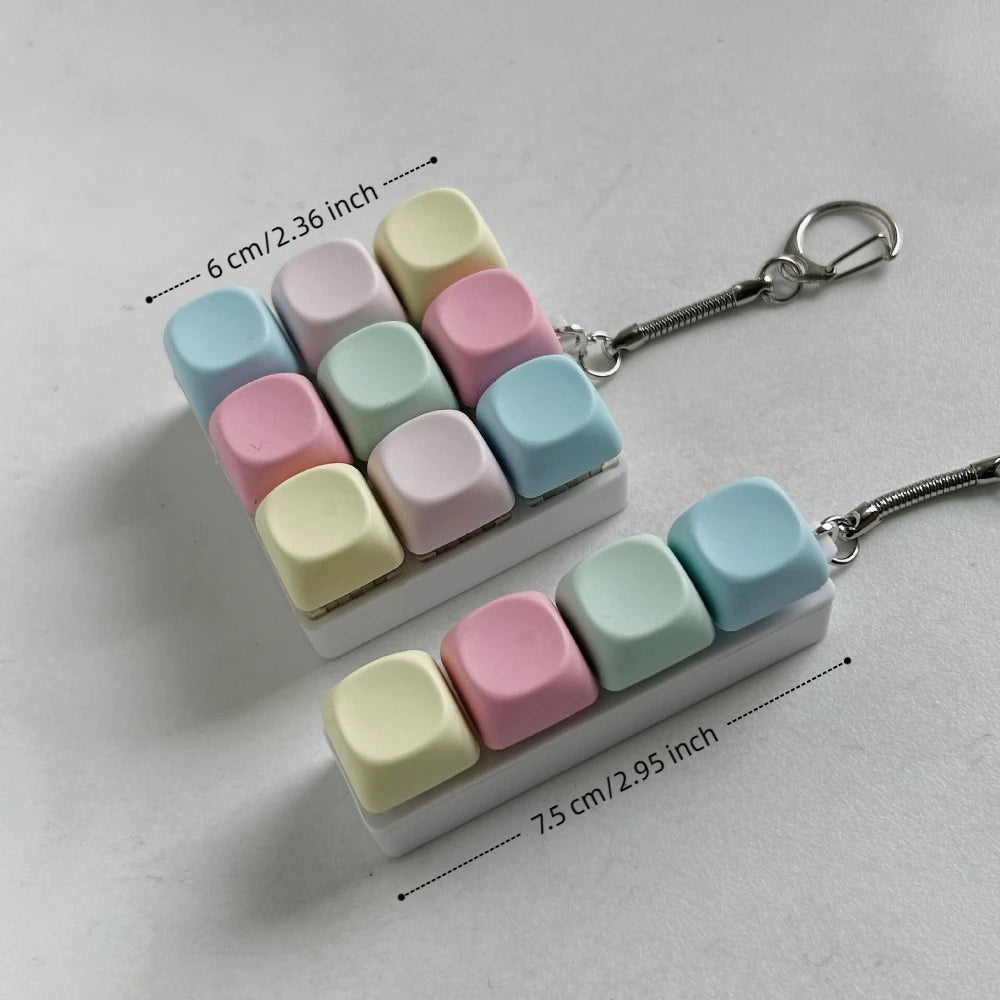 A white tactile stress relief keyboard fidget toy with colorful, squishy keys arranged in a row.