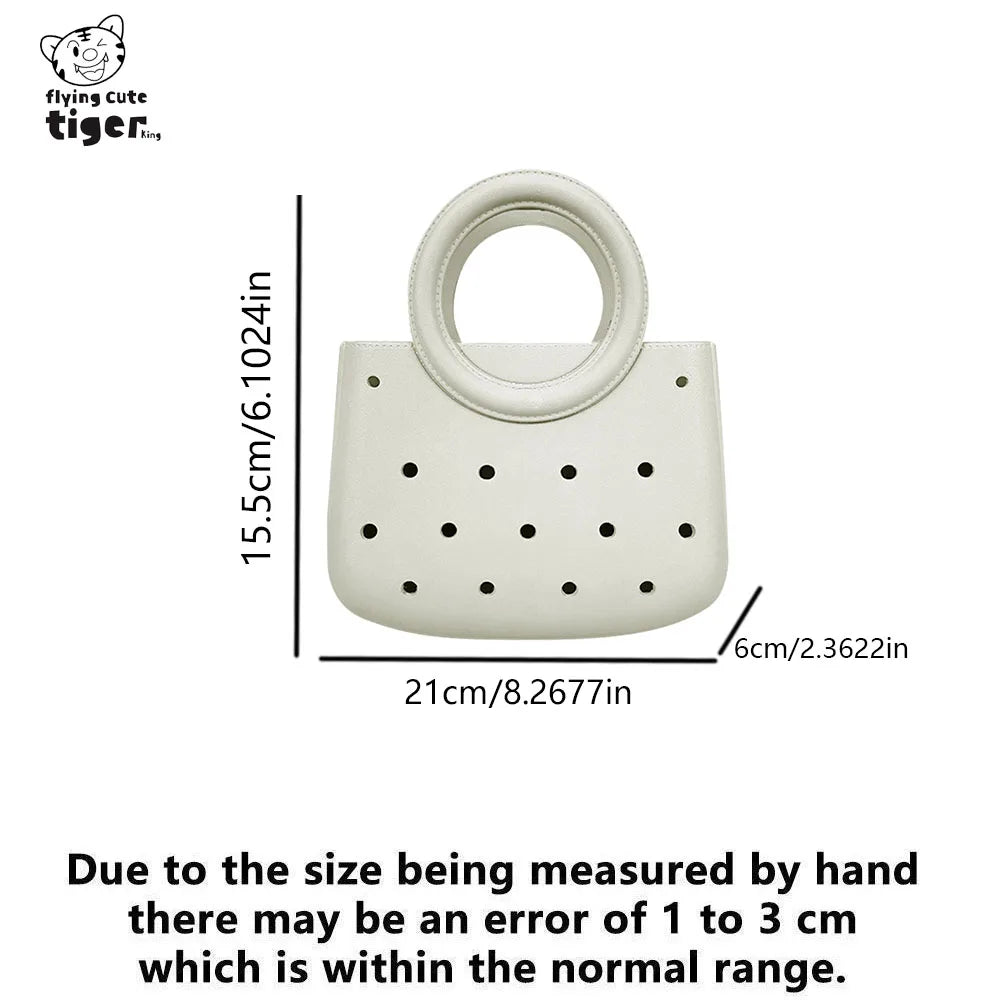 A round white PVC handbag with a handle and a pattern of small holes.