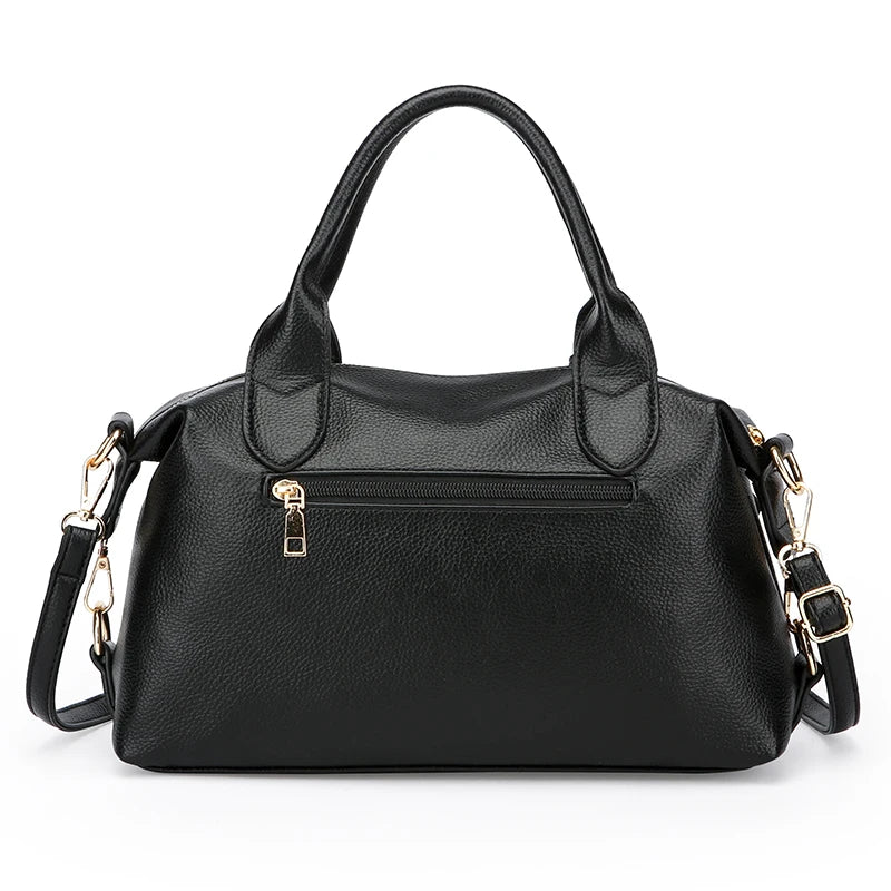 Black soft leather tote bag with gold hardware and adjustable shoulder strap