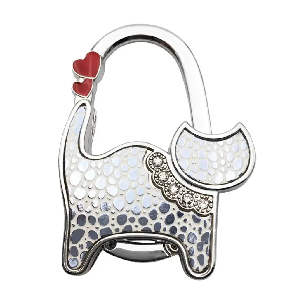 Silver portable cat handbag hooks with a heart charm and a cat silhouette design