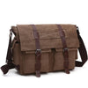 A brown canvas messenger bag for men with dark brown leather straps and buckles.