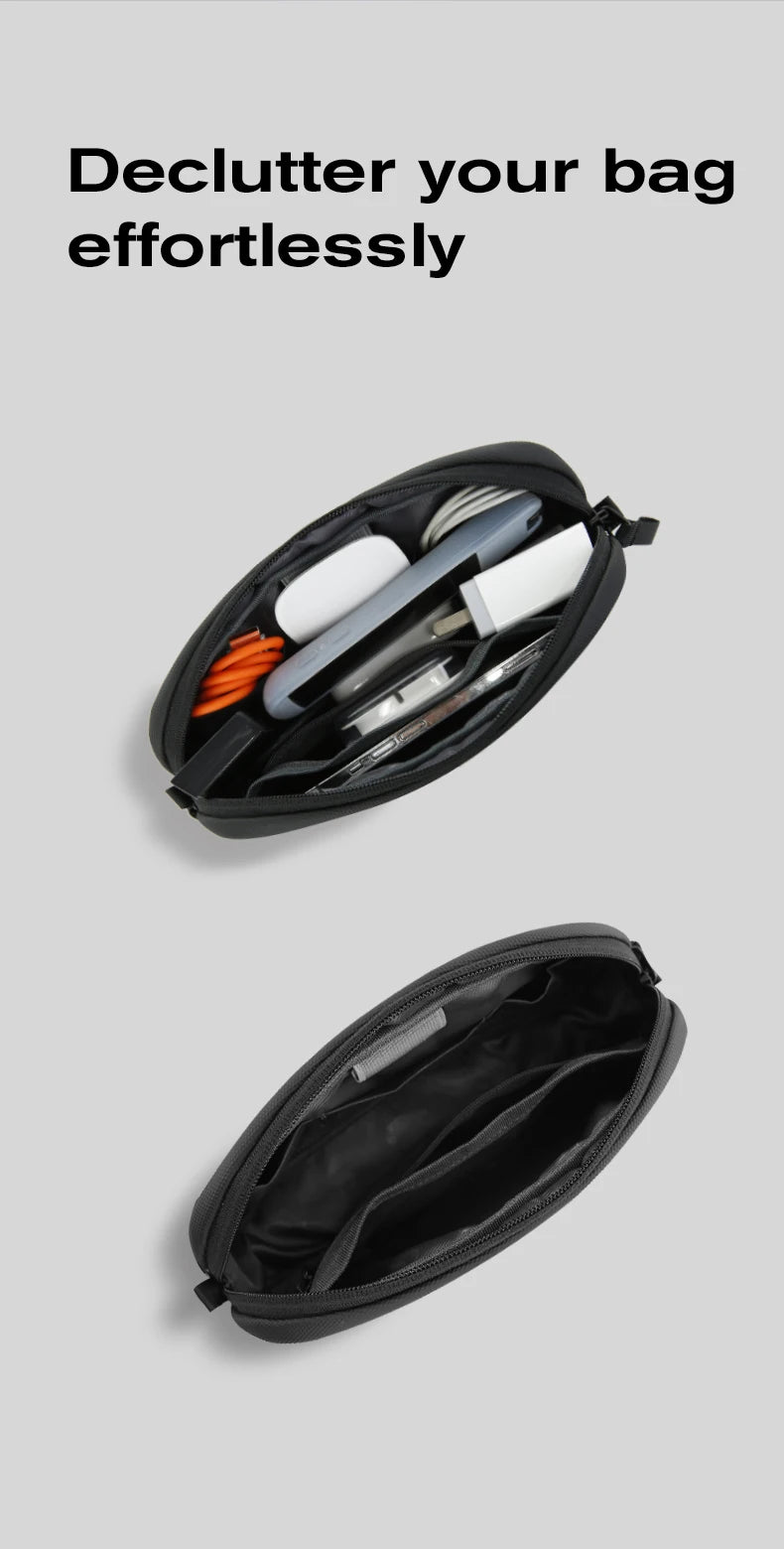 A black travel electronics organizer pouch is shown open, displaying various tools and accessories.