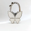Silver foldable butterfly shaped handbag hook with decorative accents