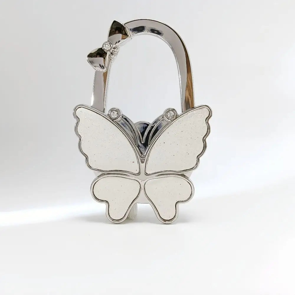 Silver foldable butterfly shaped handbag hook with decorative accents