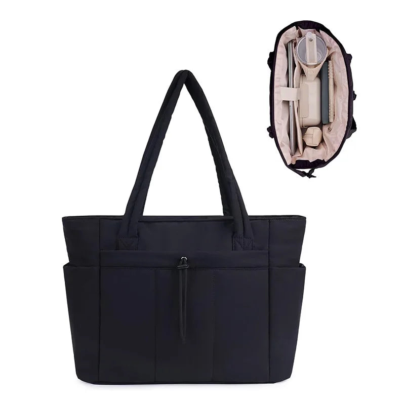 A black quilted tote bag with a shoulder strap, shown alongside its interior contents.