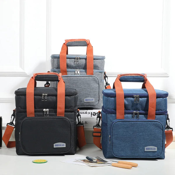 A set of three durable double layer thermal lunch bags in black and blue fabric with orange straps.