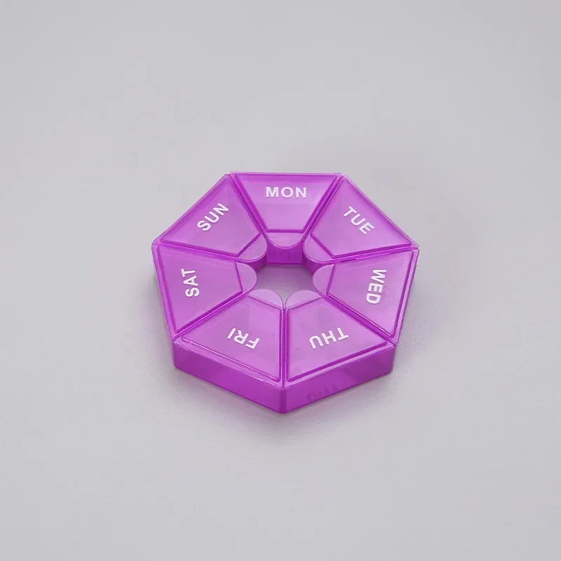 A purple 7-day weekly pill organizer with compartments labeled for each day of the week.