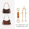 A set of gold and brown chains for decorating a bag, including an extended chain and a decorative chain.