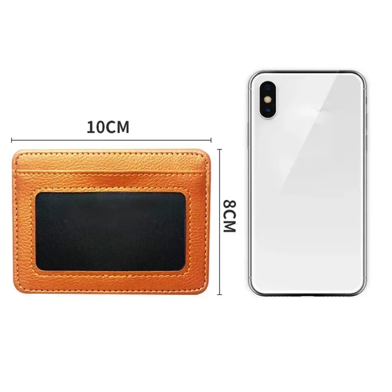 An orange slim PU leather mini wallet for cards and ID shown next to a smartphone.