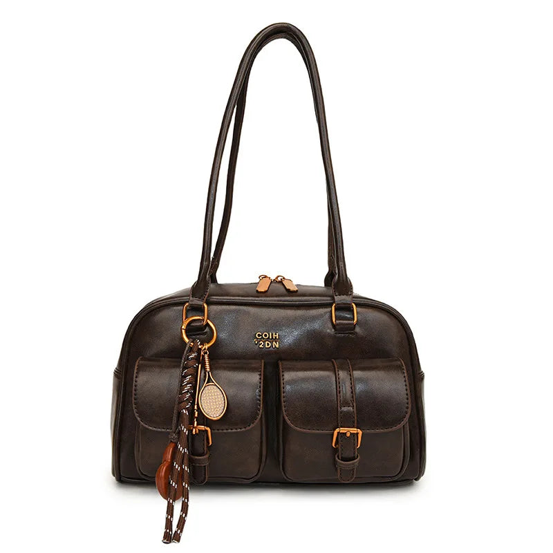 A dark brown leather vintage letter print crossbody bag with gold hardware and a leather tassel.