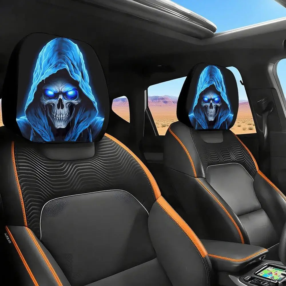 A set of two black headrest covers featuring a glowing blue gothic skull design in a car interior.