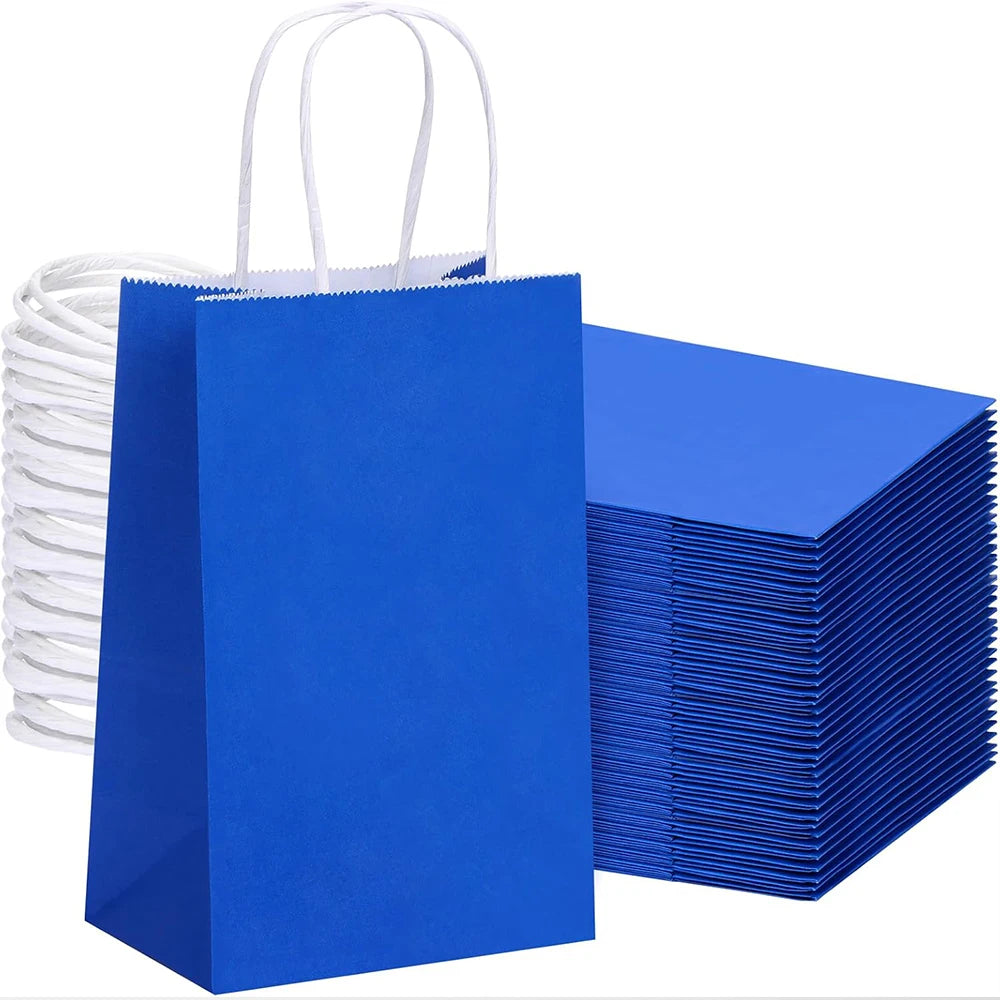 A stack of bright blue reusable kraft paper gift bags with white handles.