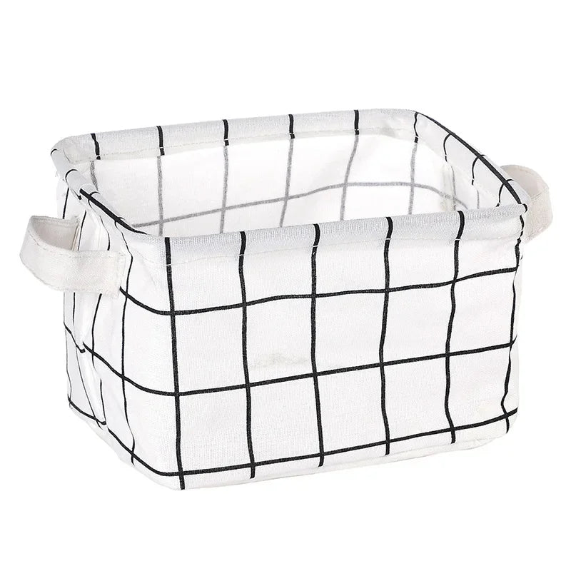 A white checkered storage basket with handles made of cotton linen fabric.