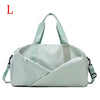 Light mint green nylon gym and travel duffel bag with a diagonal fold design