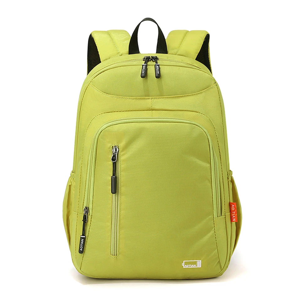 A lime green fashion commuter daypack for women with black accents.