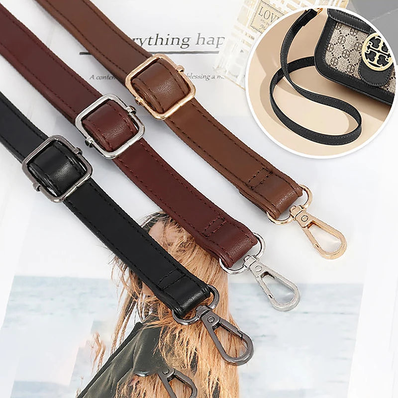 Close-up view of brown and black PU leather crossbody bag straps with gold hardware.