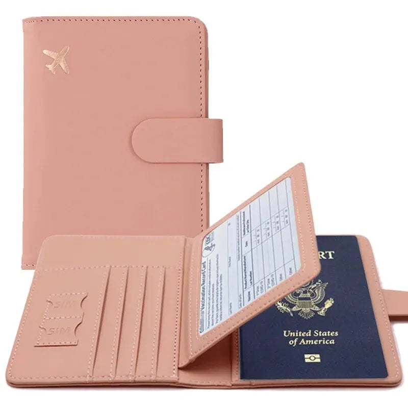 A pink PU leather passport holder with credit card slots and a leather cover.