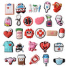 A collection of decorative shoe charms and pins for clogs and sandals, including various shapes and colors.