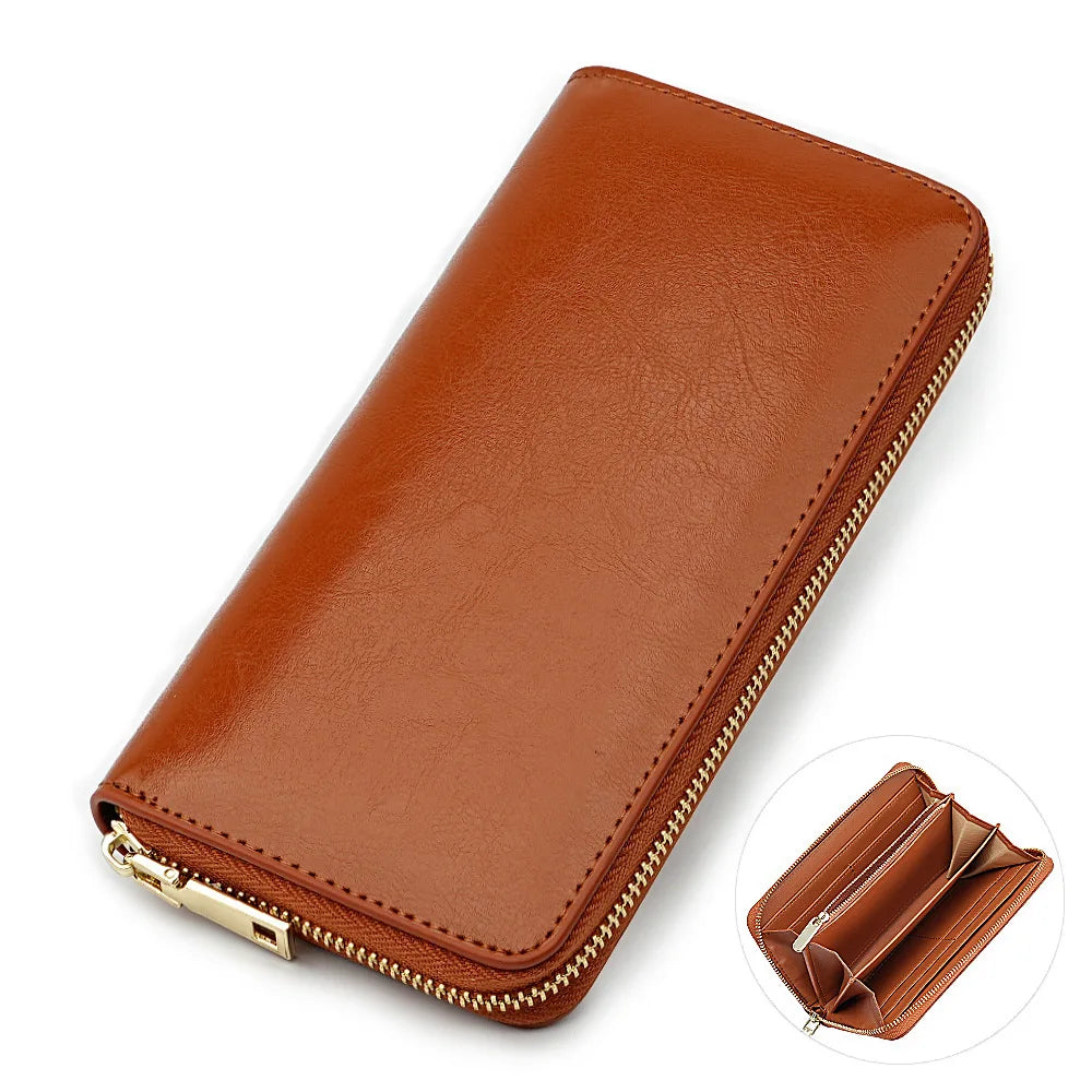 A brown genuine leather zipper wallet shown in a diagonal view with a close-up of the interior.