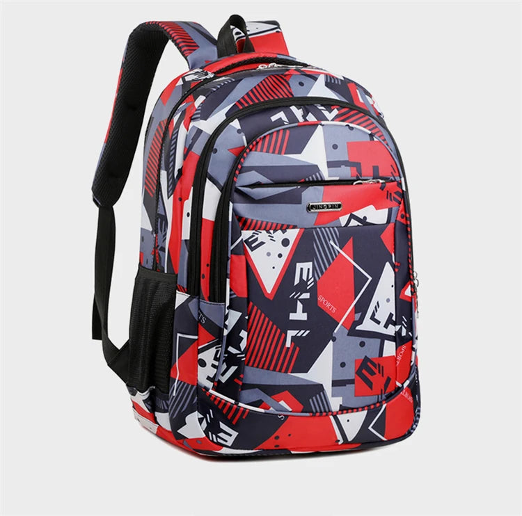 A versatile unisex backpack in a geometric pattern featuring red, gray, and navy blue for laptop and daily carry.