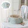 Light blue instant-open flat lay makeup organizer bag with a drawstring closure displayed on a white table.