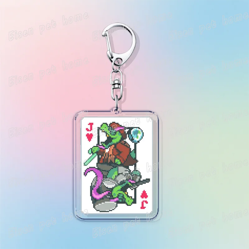 A silver keychain featuring a pixel art design of a Deltarune character with poker cards.