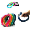 A hand is holding a colorful D-Type portable grocery bag carrier with various colored rings.