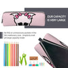 A pink elegant leather pencil case featuring a black silhouette design, shown next to colored pencils and a pair of scissors.