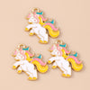 Two gold-colored unicorn horse charm pendants with white bodies and rainbow colored manes