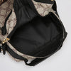 A black and beige patterned men's crossbody sling bag with a gold zipper visible.