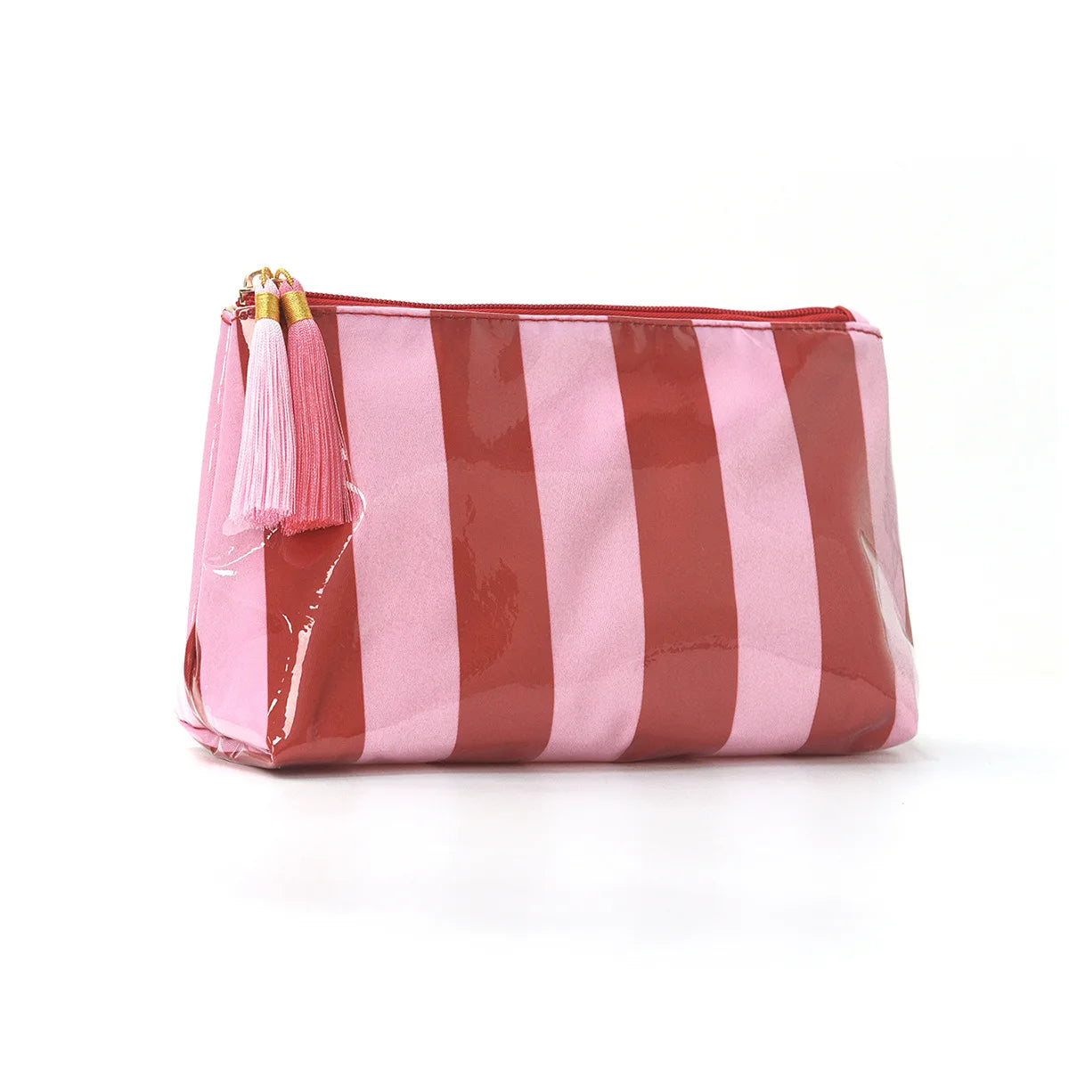 A pink and brown striped cosmetic travel pouch with a gold fringe detail.