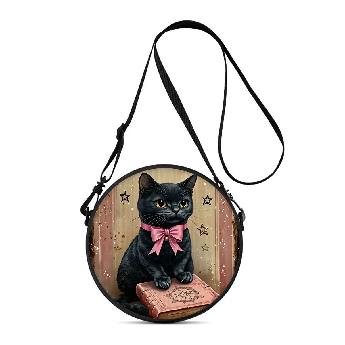 A black cartoon cat illustration on a round crossbody bag with a pink bow and an open book design.