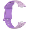 Correa de silicona morada con estampado floral para un reloj inteligente, vista de lado.